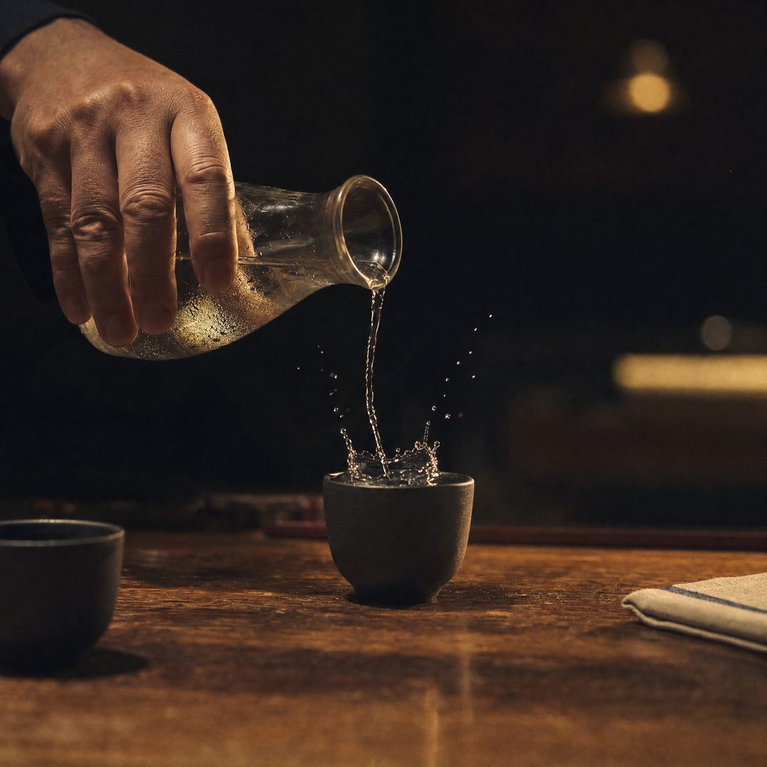 Cold sake poured into a handmade cup